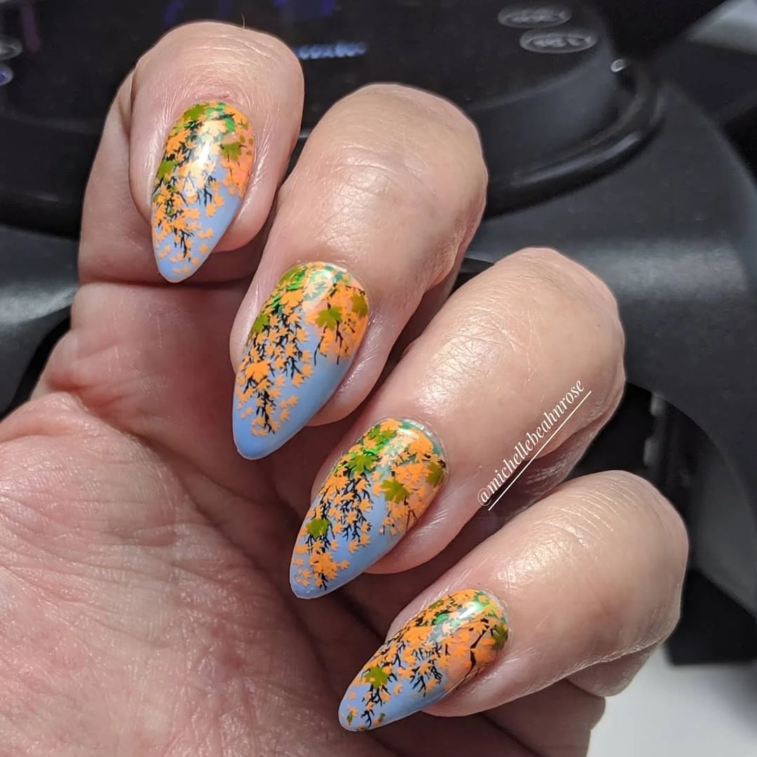 fall nail art ideas 2026 Powder Blue Nails With Autumn Wildflowers