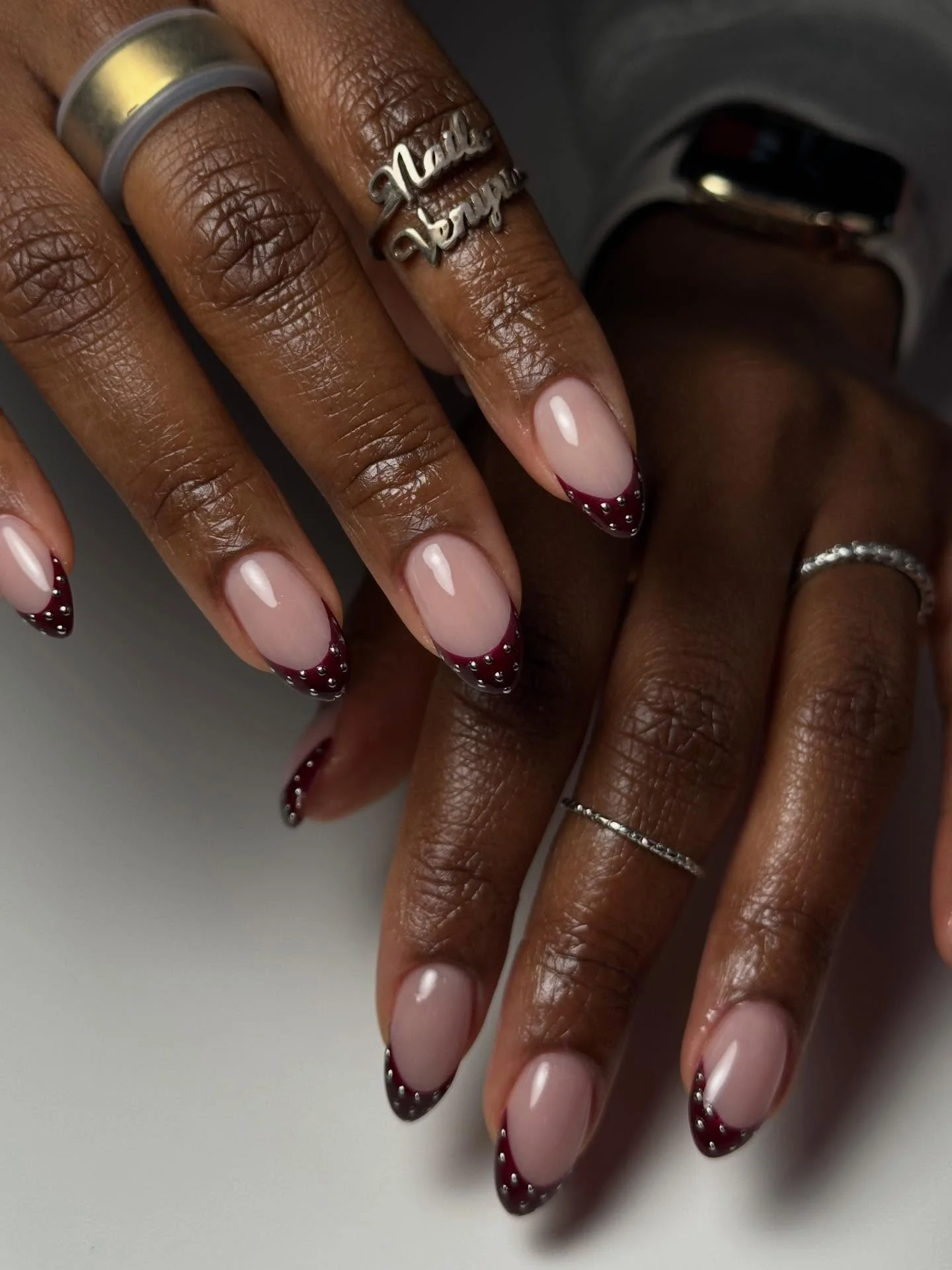 fall nails for dark skin 2026 Burgundy French Tips With Modern Metallic Details
