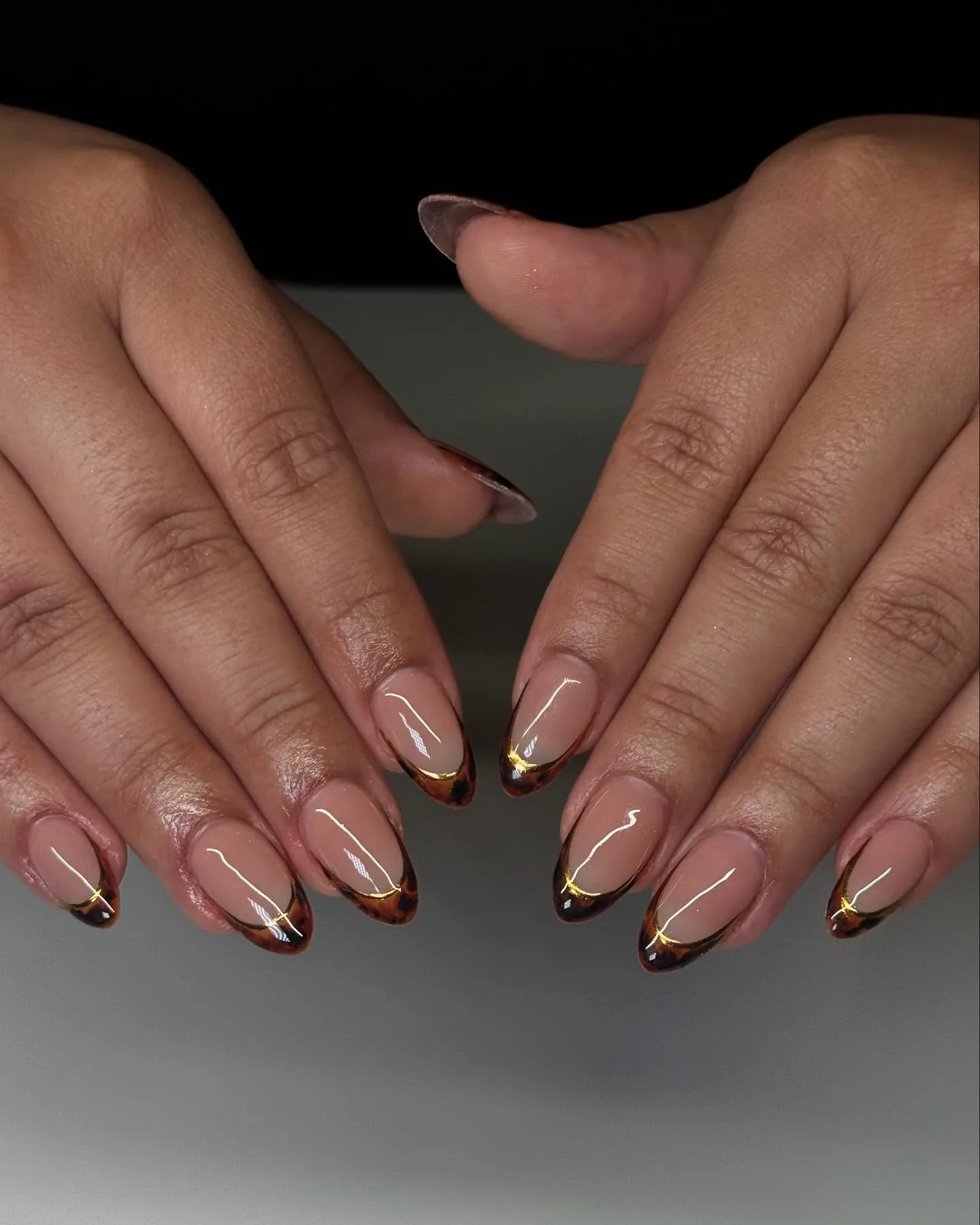 fall short almond nails 2026 Glossy Tortoiseshell French With Golden Edge