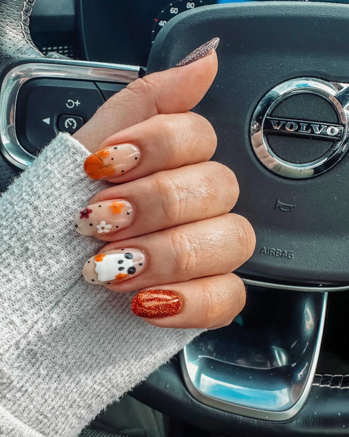halloween nails designs 2026 Autumn Pumpkin And Floral Details With Sparkling Copper
