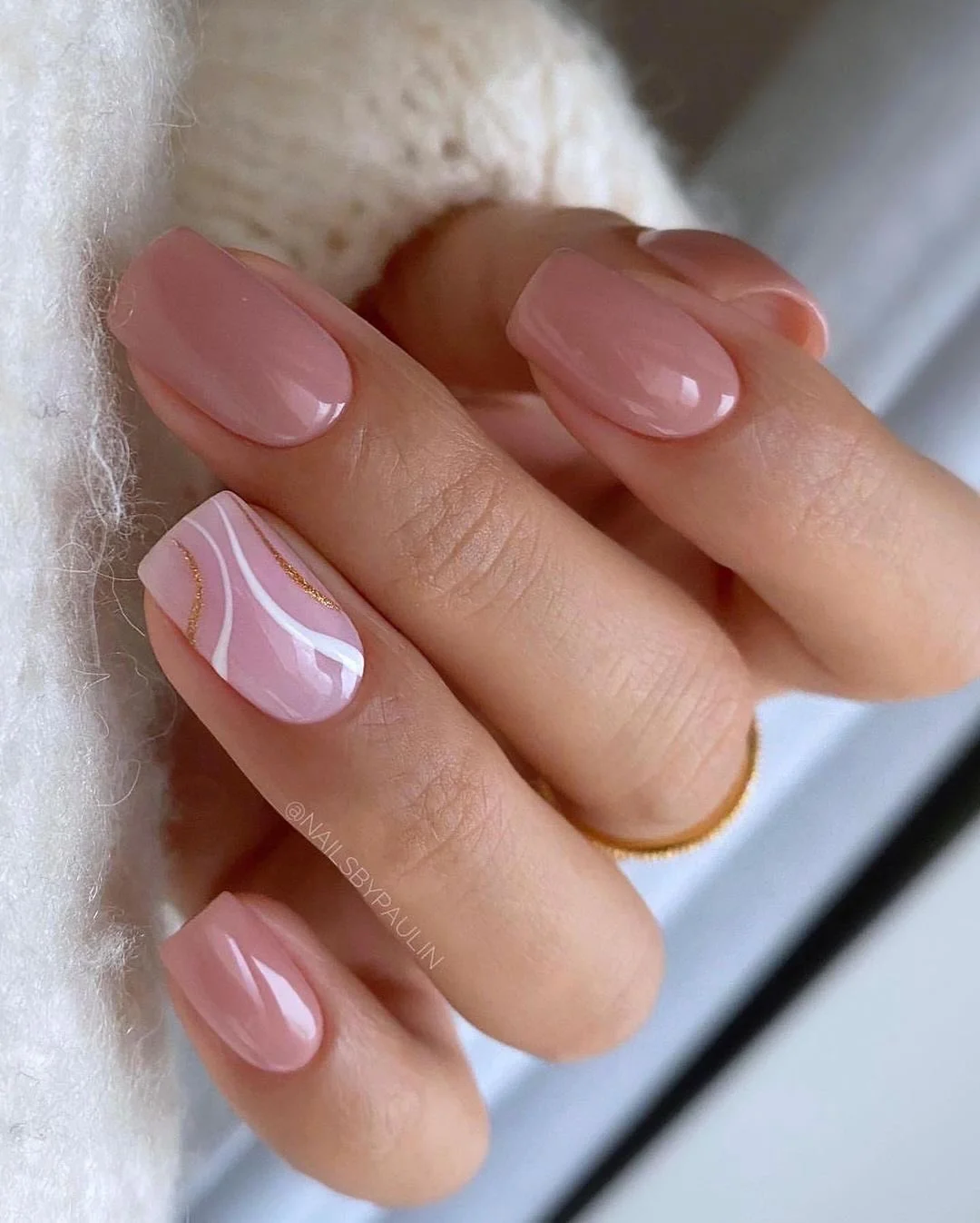 nude fall nails 2026 Glossy Blush Nude With Fine White And Gold Waves