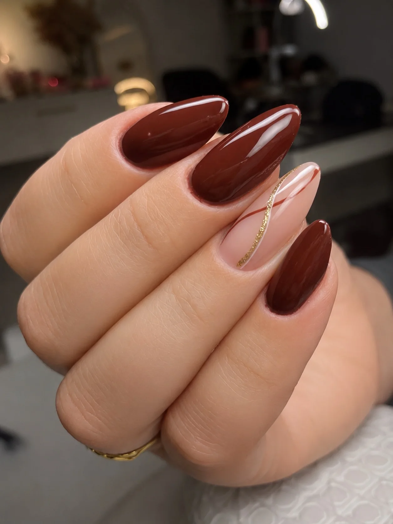 fall accent nail designs 2026 Glossy Burgundy Nails With A Fine Gold Accent