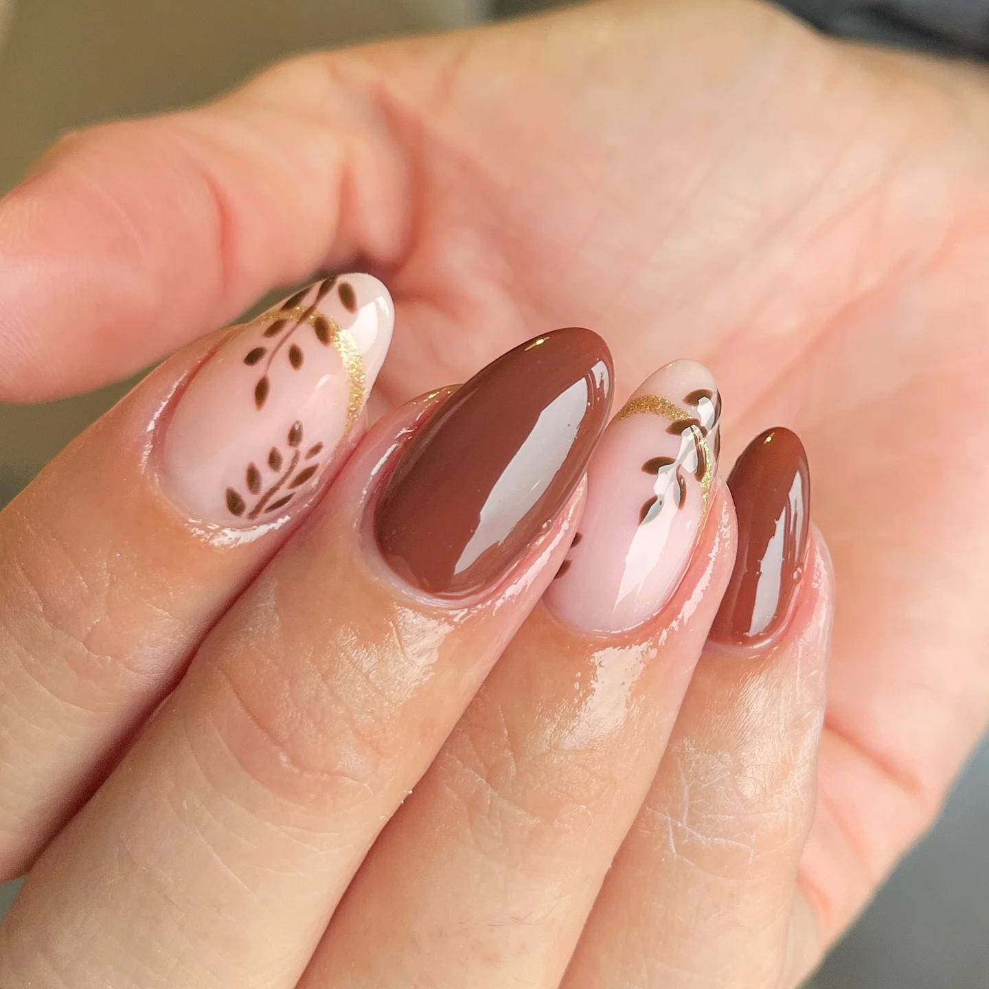fall gel nails ideas 2026 Chocolate Botanical Nails With Gold Details