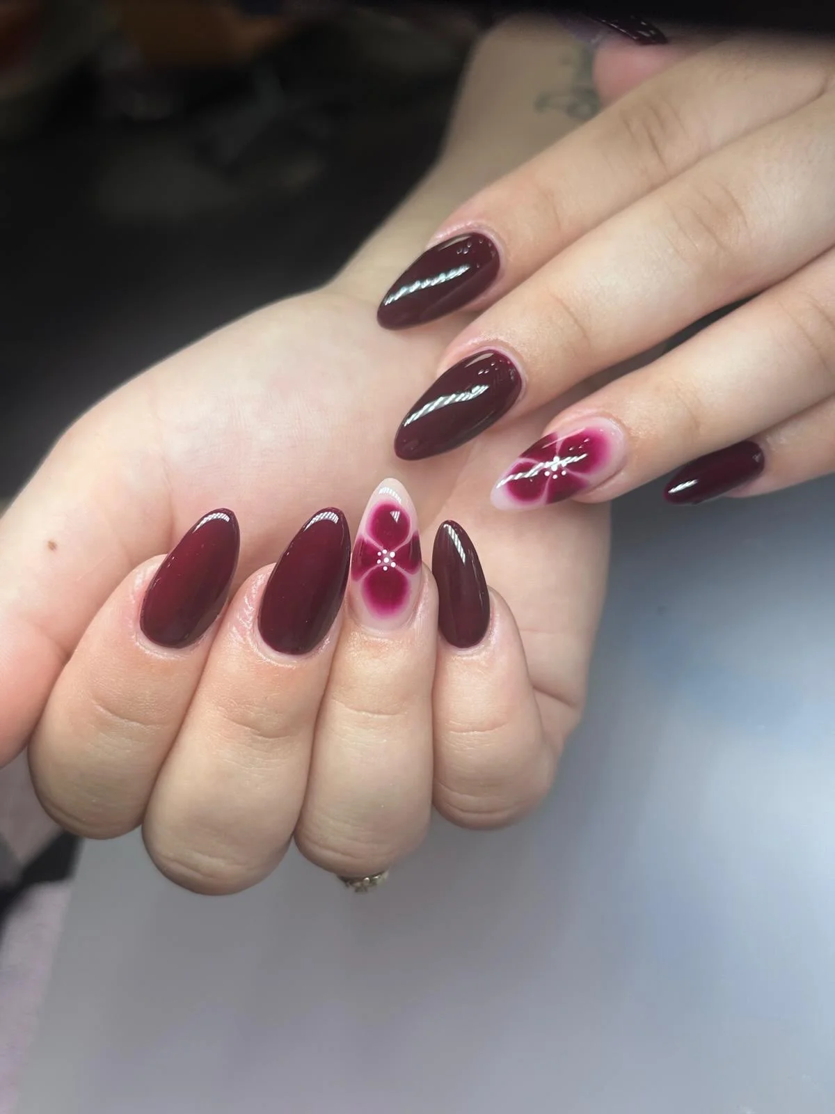 fall nails for pale skin 2026 Deep Burgundy And Soft Floral Accents