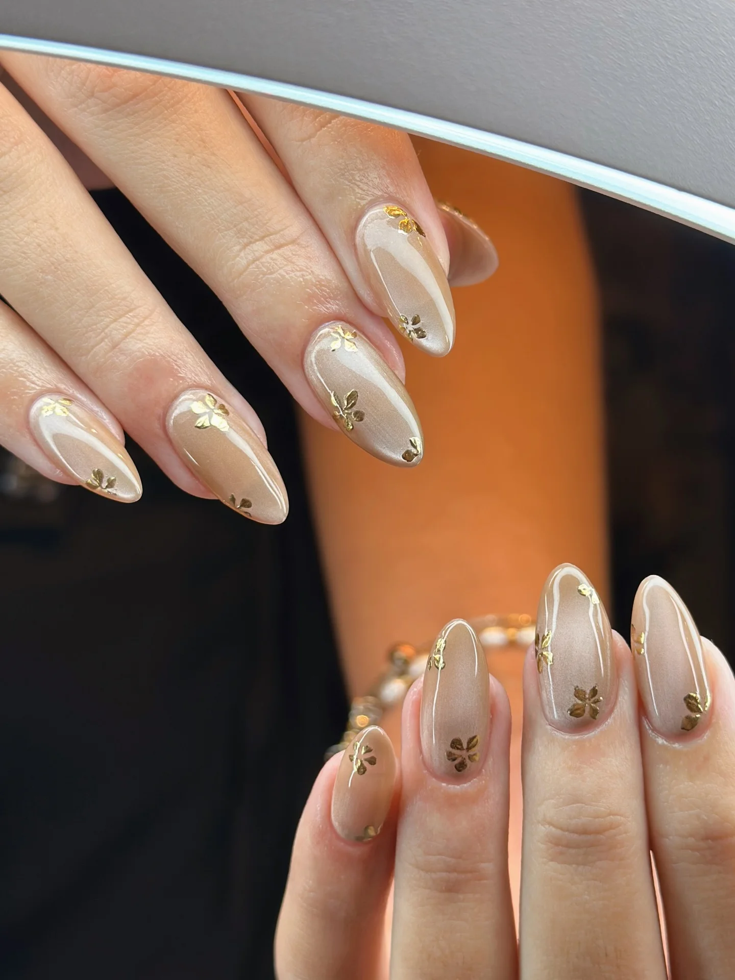 fall wedding nails 2026 Champagne Pearl Nails With Gold Botanical Accents