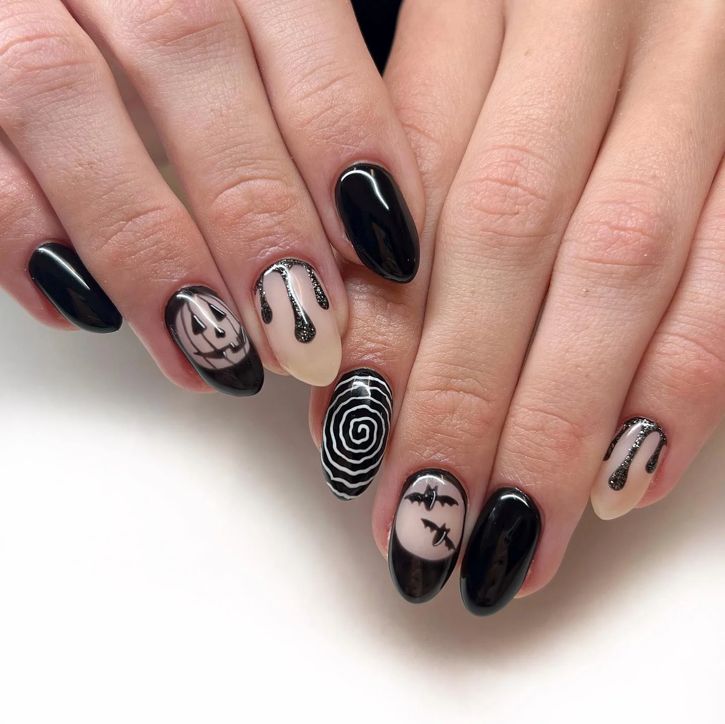 halloween nail art 2026 Glossy Black Nails With Graphic Halloween Details