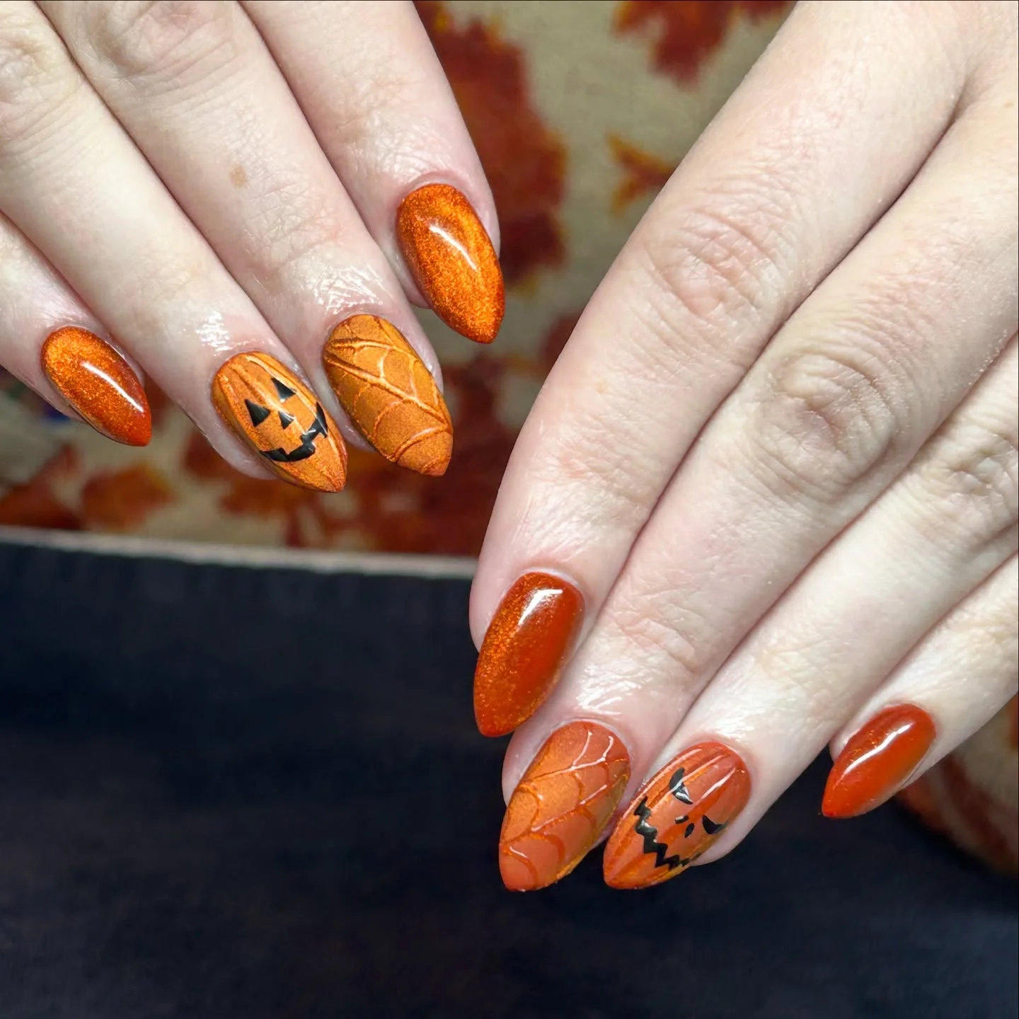 halloween nails designs 2026 Glowing Orange Pumpkin Nails With Carved Details