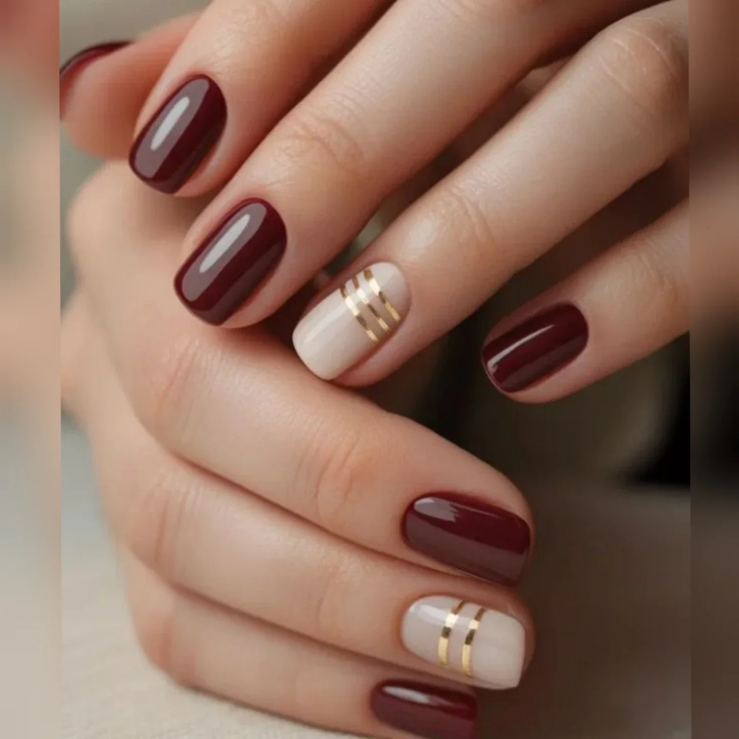 fall burgundy nails with design Burgundy And Cream With Refined Gold Stripe Details