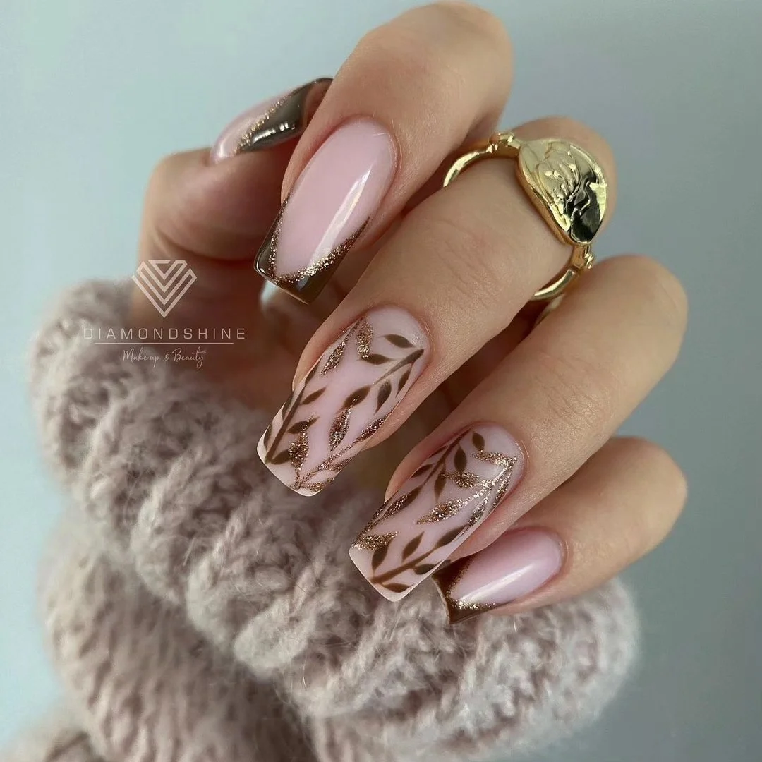 fall nails for fair skin tones 2026 Elegant Blush Nails With Brown And Gold Leaf Detailing