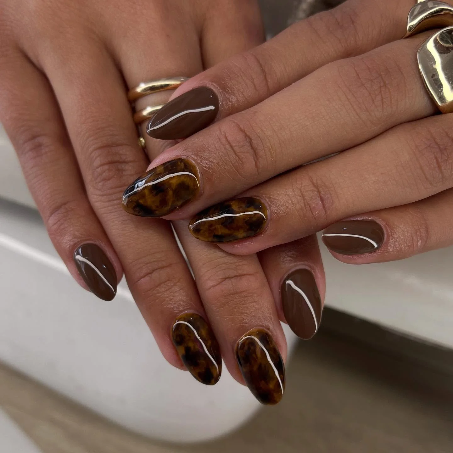 fall nails for medium skin tone Espresso Brown And Amber Tortoiseshell With Fine White Lines