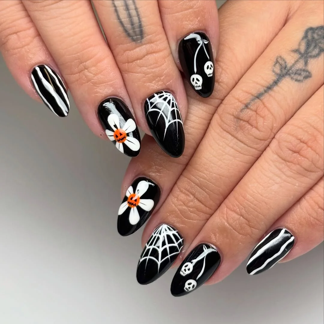 halloween nails designs 2026 Black Halloween Nails With Skulls Webs And Pumpkin Flowers
