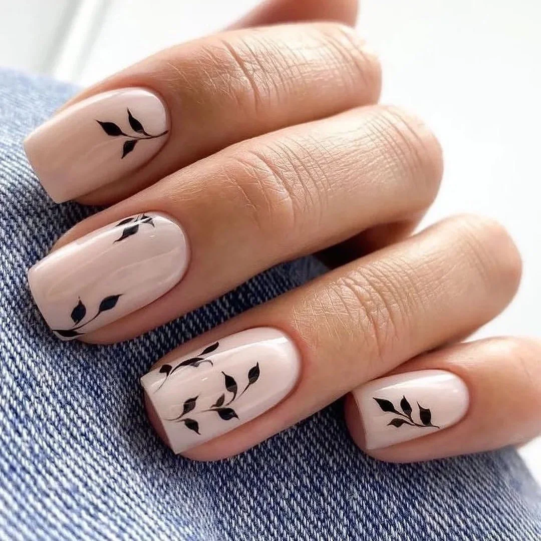 nude fall nails 2026 Short Nude Nails With Tiny Black Botanical Details