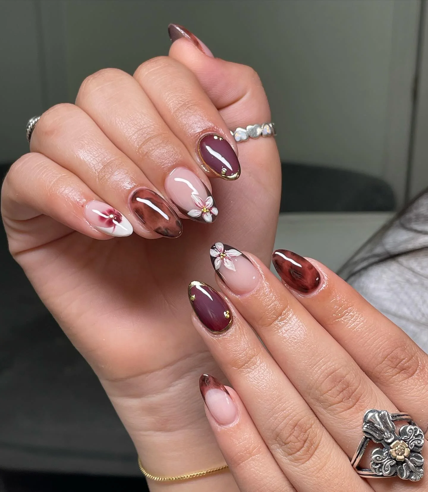 fall short almond nails 2026 Chocolate Florals With Burgundy Autumn Elegance
