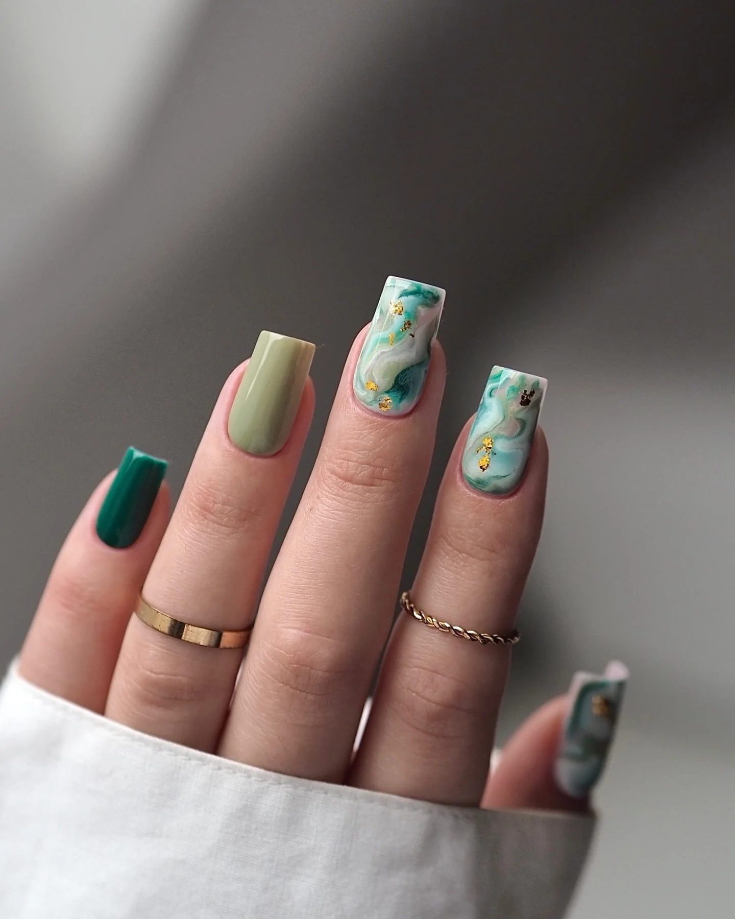 fall trendy nails 2026 Emerald And Sage Marble With Gold Accents
