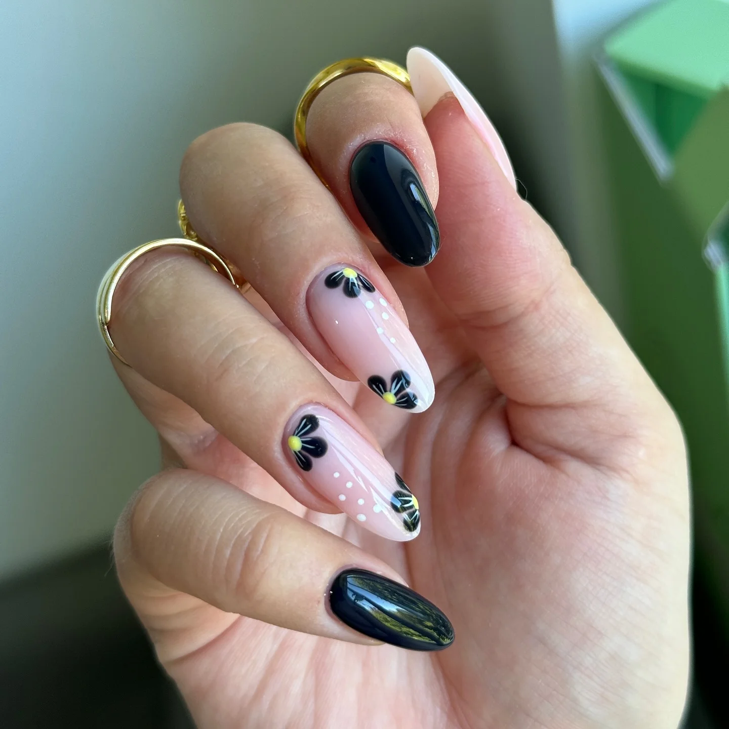 dark fall nails 2026 Minimal Black Floral Almond Manicure
