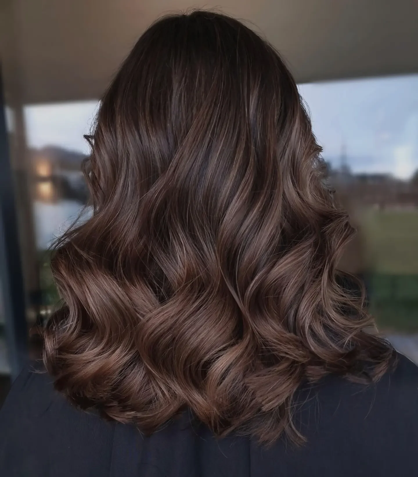 fall brown hair color ideas 2026 Soft Cocoa Brown Lob With Elegant Waves