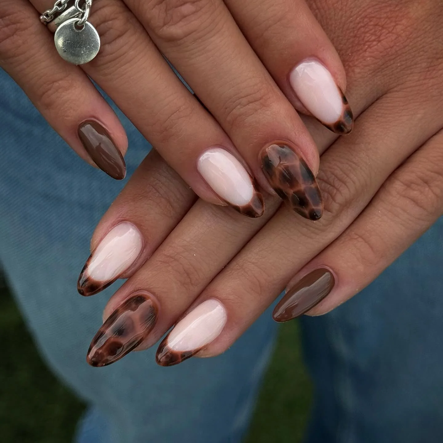 fall trendy nails 2026 Milky Pink And Tortoiseshell Almond Tips