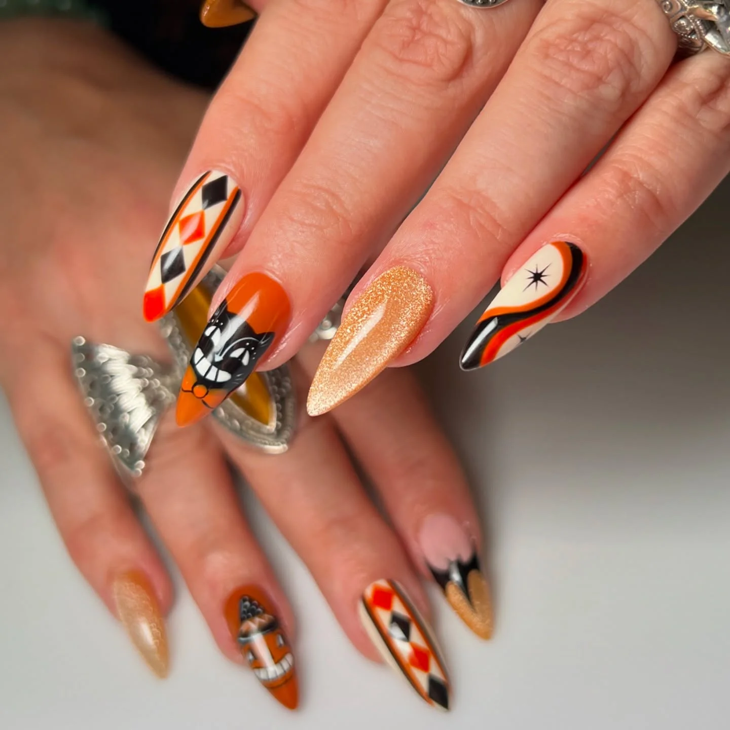 halloween nail art 2026 Retro Orange Halloween Nails With Graphic Details
