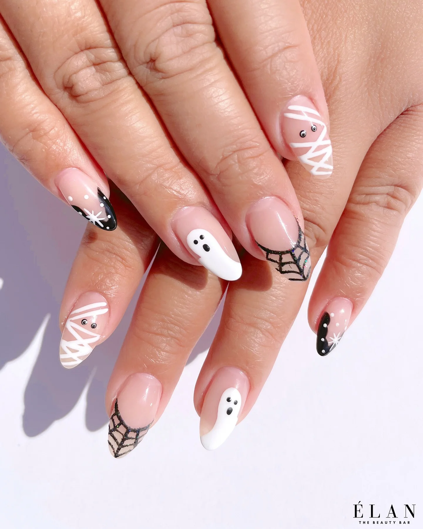 halloween nails designs 2026 Minimal Ghost And Spider Web French Tips
