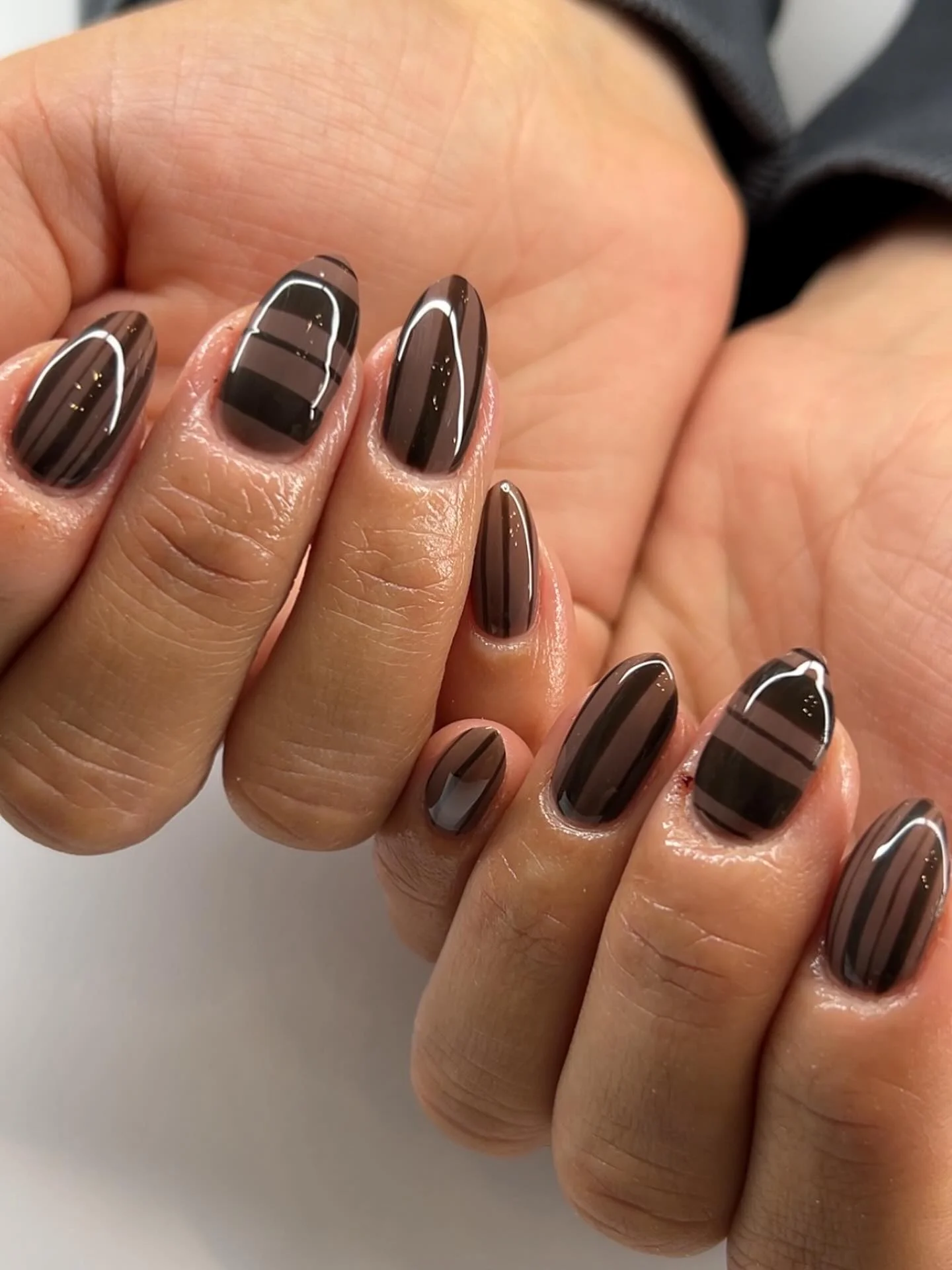 dark fall nails 2026 Smoky Mocha Gloss With Modern Stripe Details