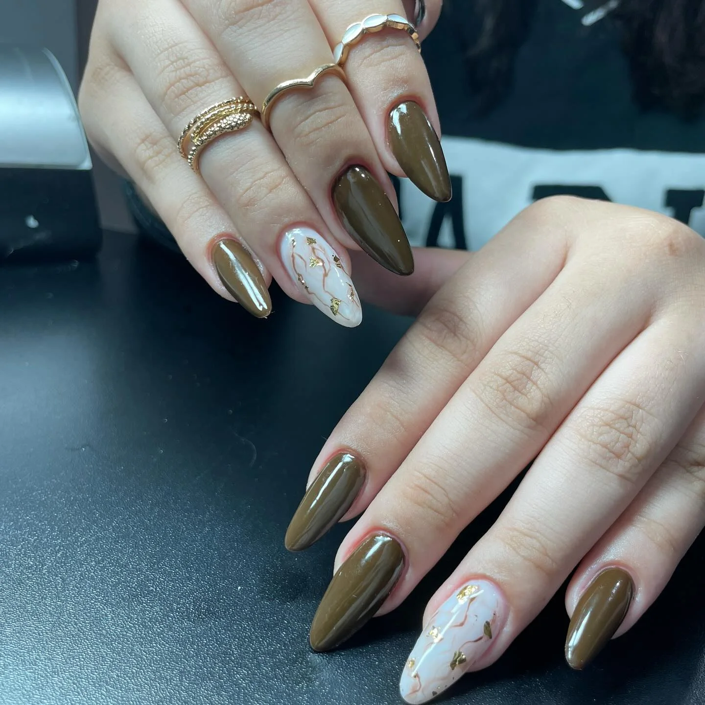 fall gel nails ideas 2026 Olive Marble Accent Nails With Gold Foil Details