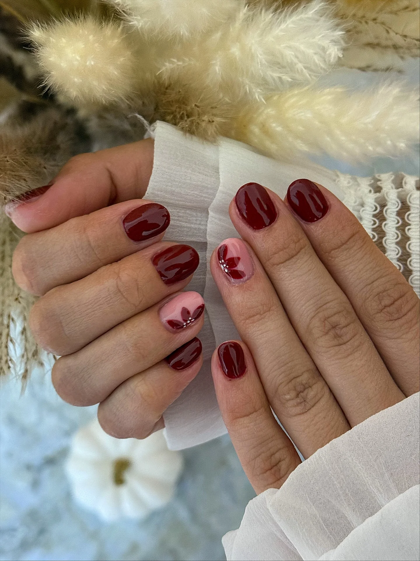 fall trendy nails 2026 Glossy Burgundy With Tiny Floral Details
