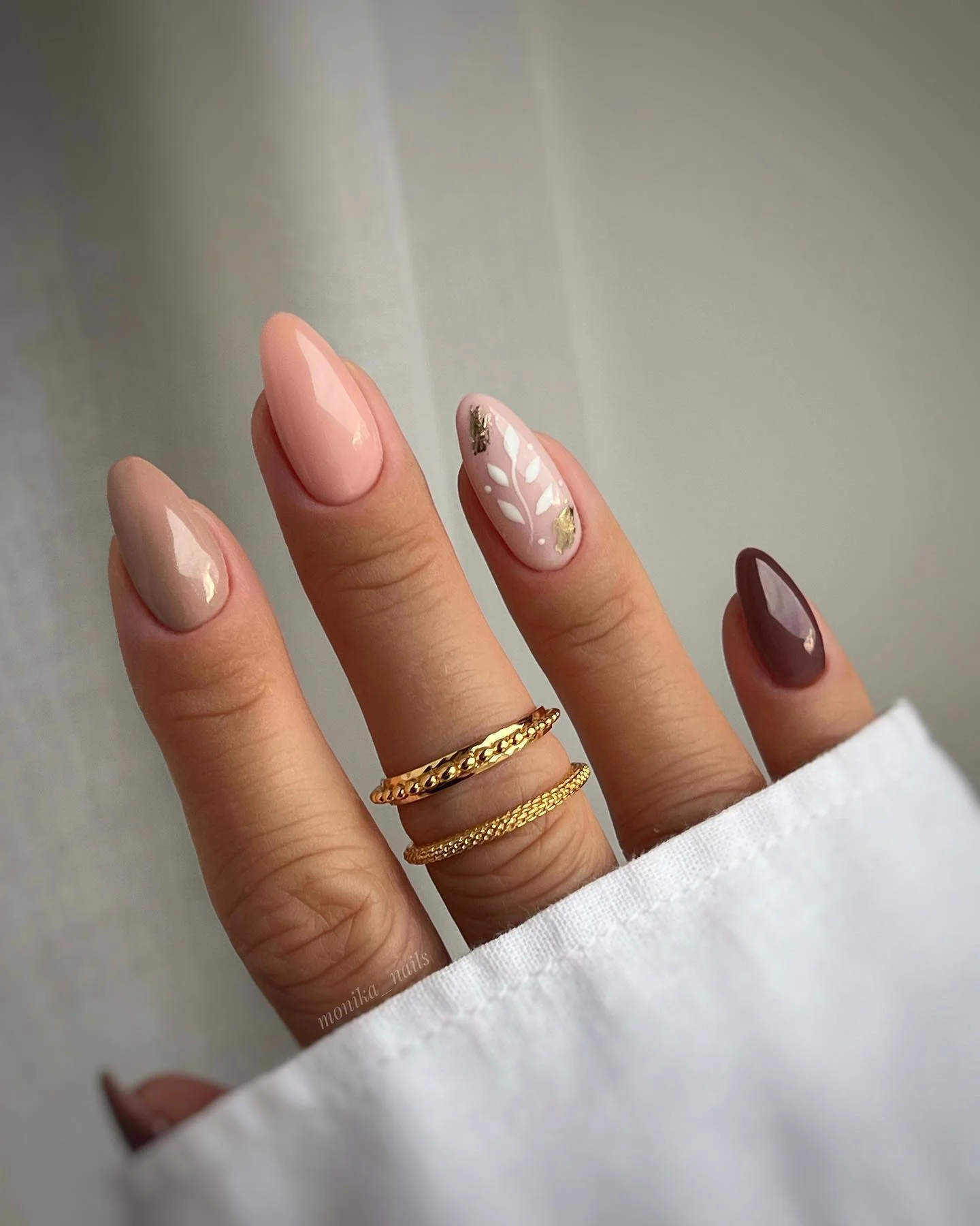 fall nails with accent nail Soft Pink Almond Nails With Delicate Golden Leaves