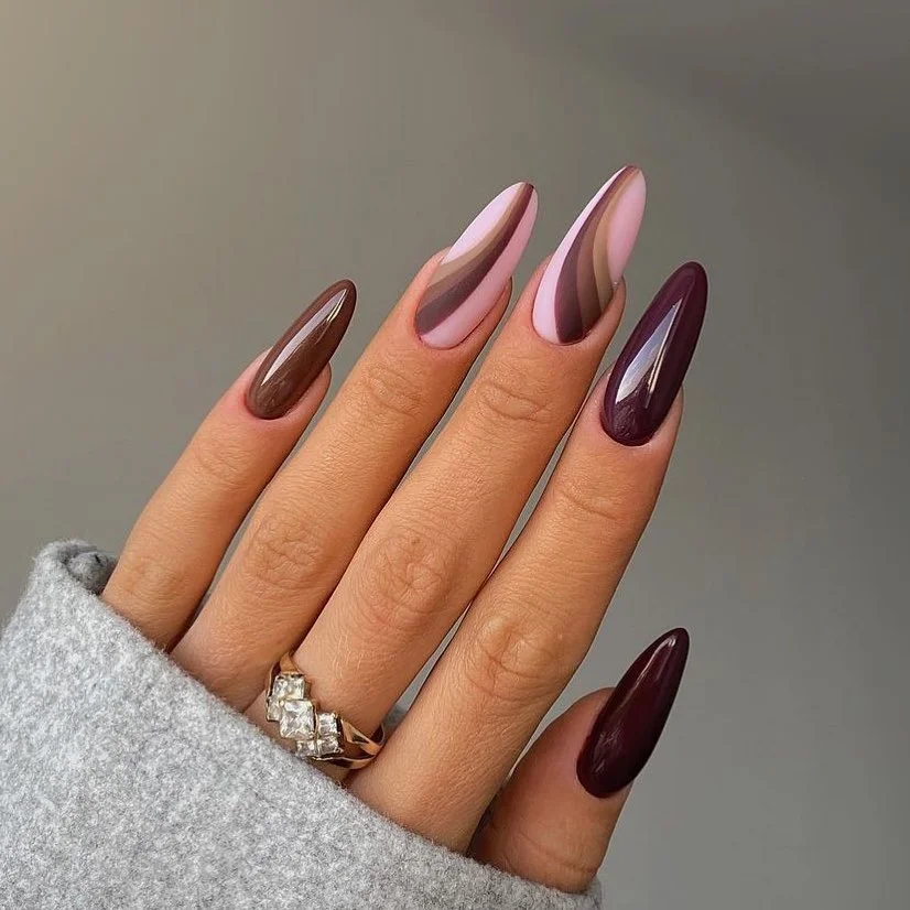 maroon fall nails 2026 Glossy Maroon Almond Nails With Soft Plum Waves