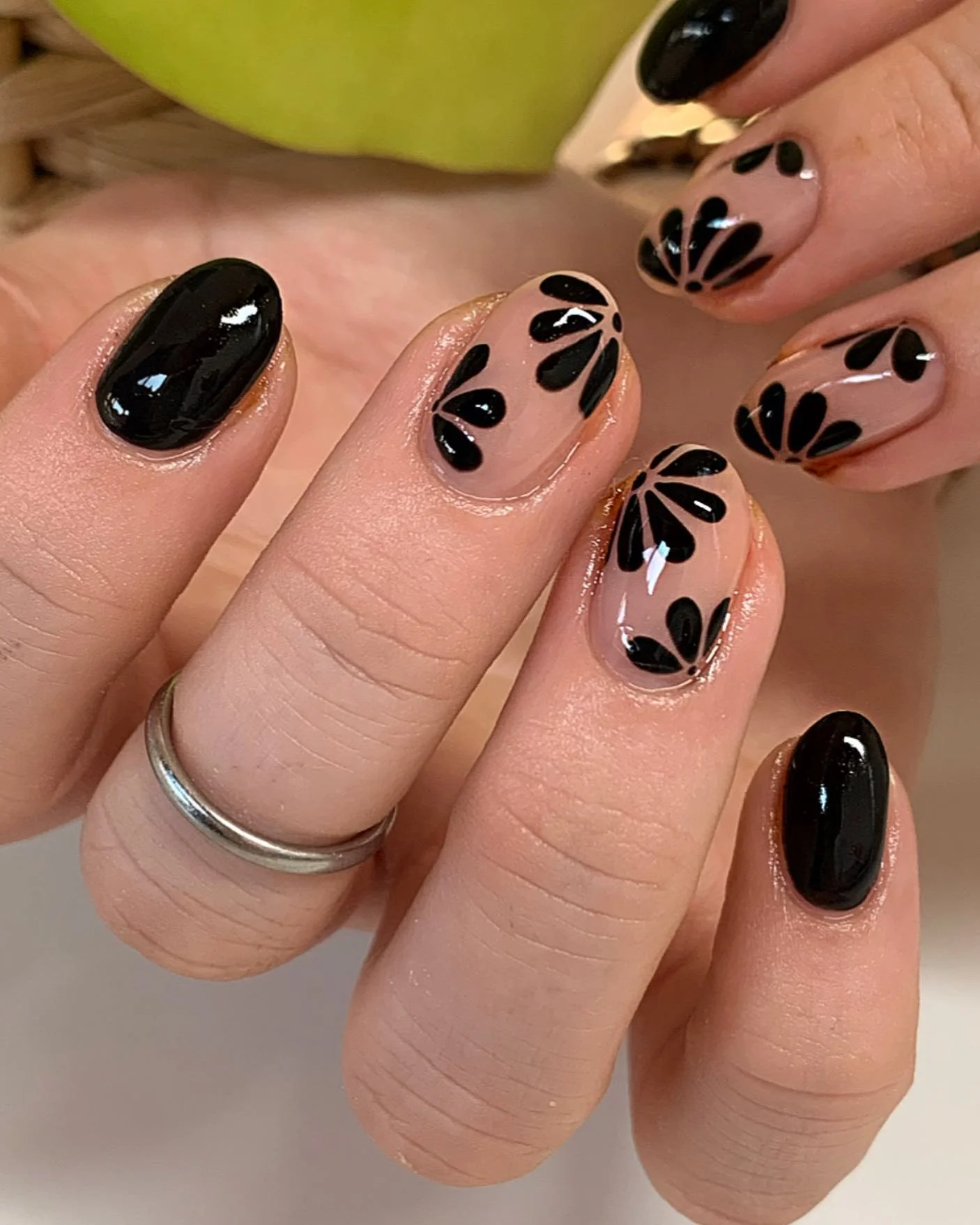 dark fall nails 2026 Glossy Black Floral Nails With A Modern Minimalist Twist