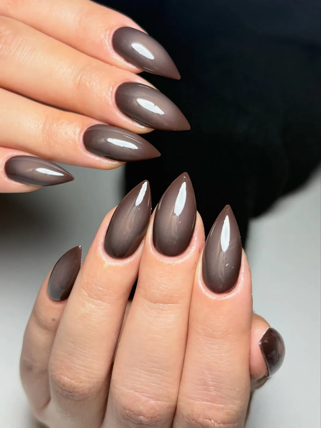 fall manicure colors 2026 Glossy Espresso Almond Nails With A Minimalist Finish
