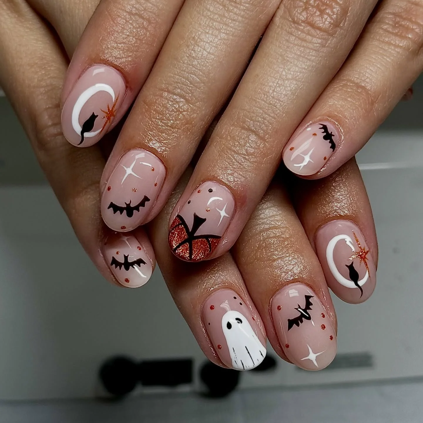 halloween nails designs 2026 Playful Bat And Ghost Halloween Nails In Soft Pink