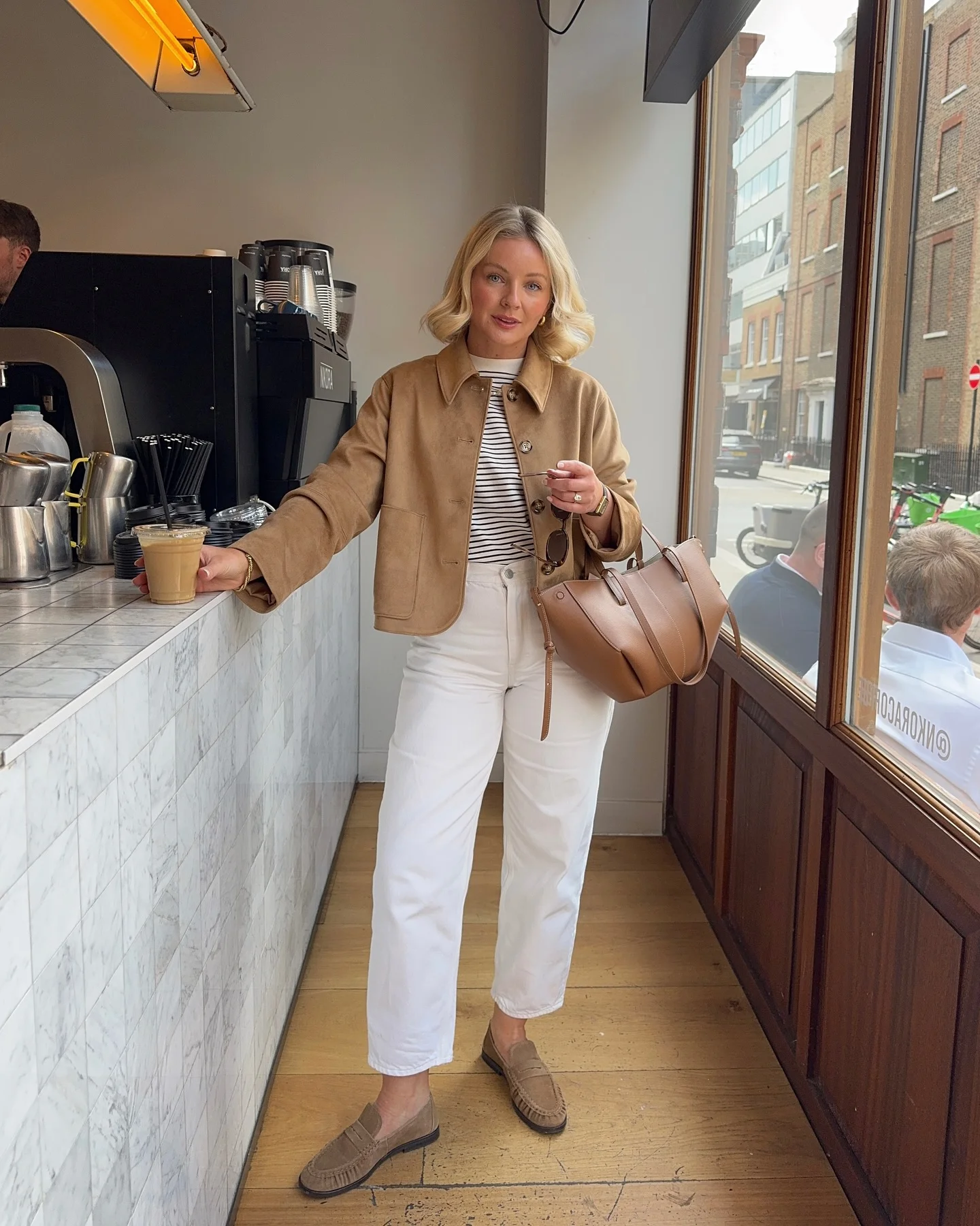 september fashion trends Tan Jacket With Striped Top And White Jeans