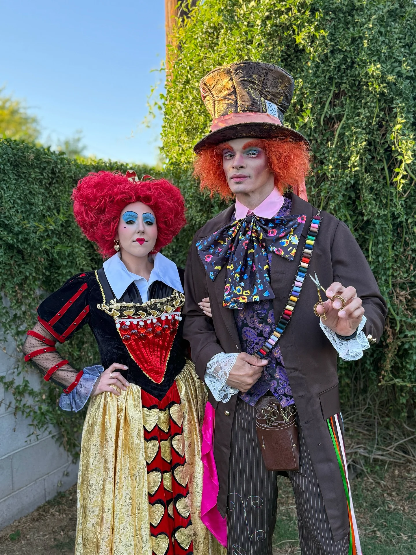 trendy halloween outfits 2026 Whimsical Mad Hatter And Queen Of Hearts Duo