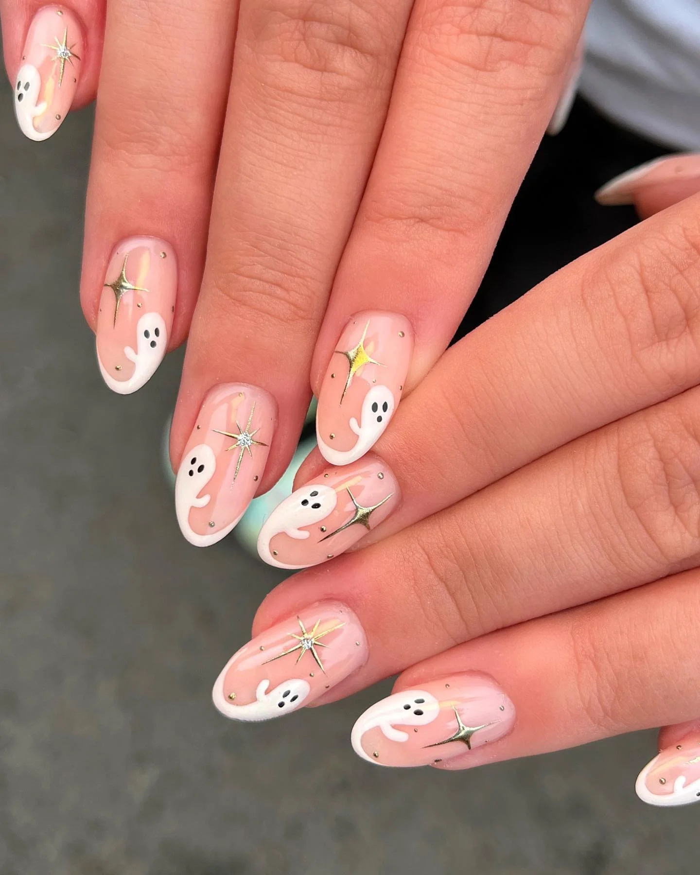 halloween nails designs 2026 Ghostly Pink Almond Nails With Celestial Sparkle