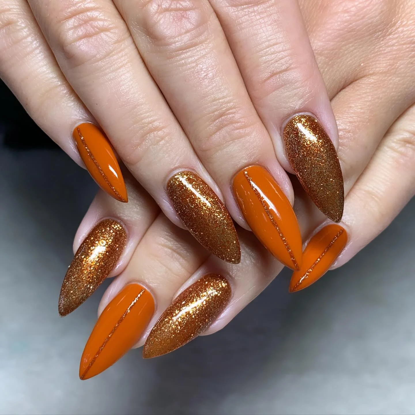 fall nails for pale skin 2026 Burnt Orange And Copper Glitter Statement Nails