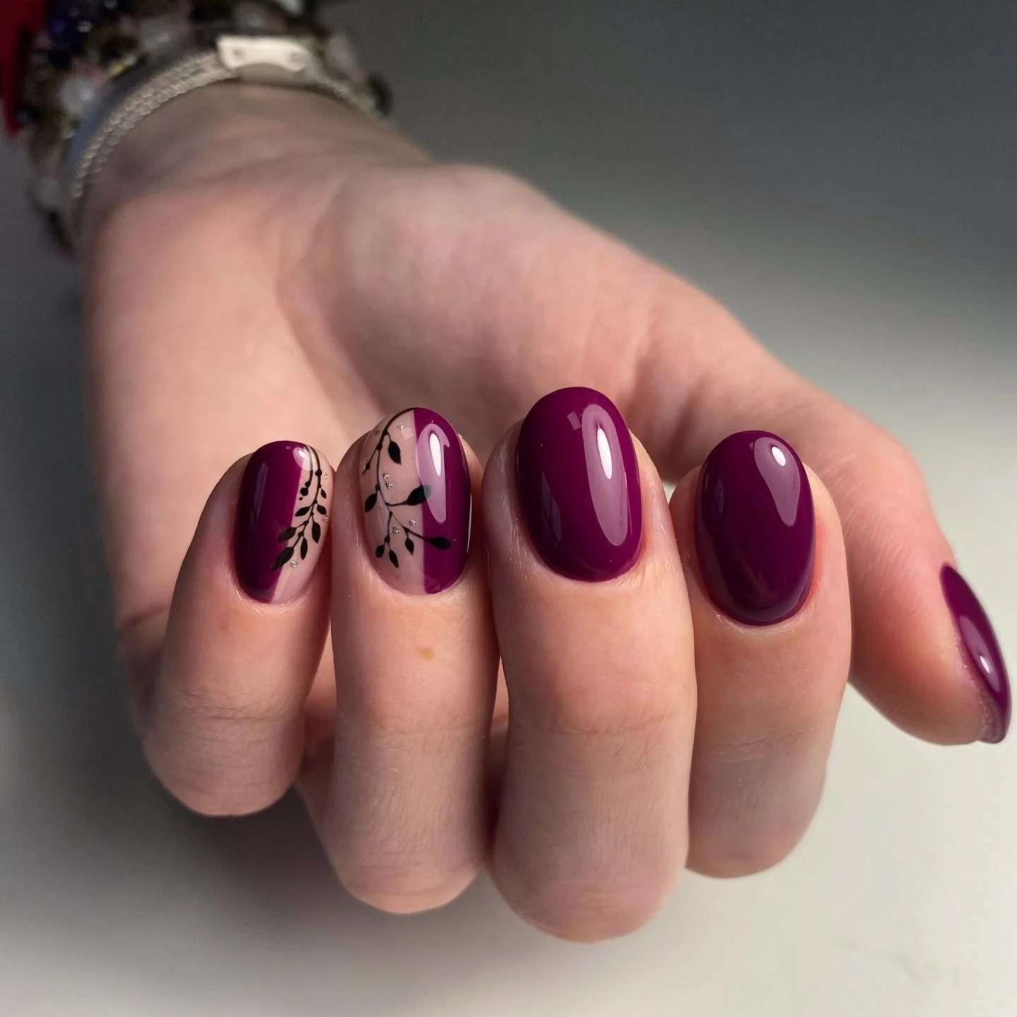 maroon fall nails 2026 Dark Burgundy Nails With Delicate Botanical Leaves