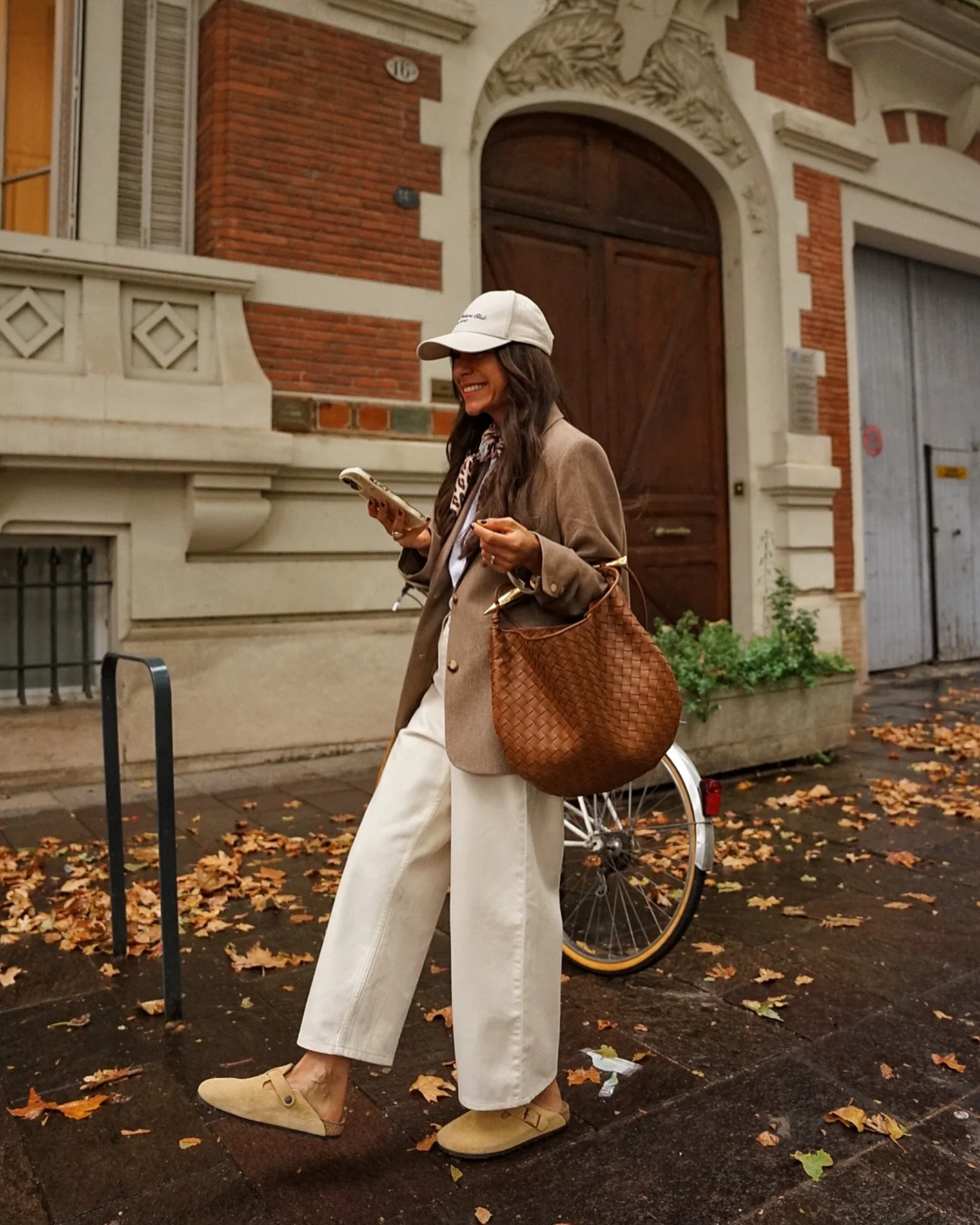 september fashion outfits Brown Blazer With Cream Trousers And Sporty Cap